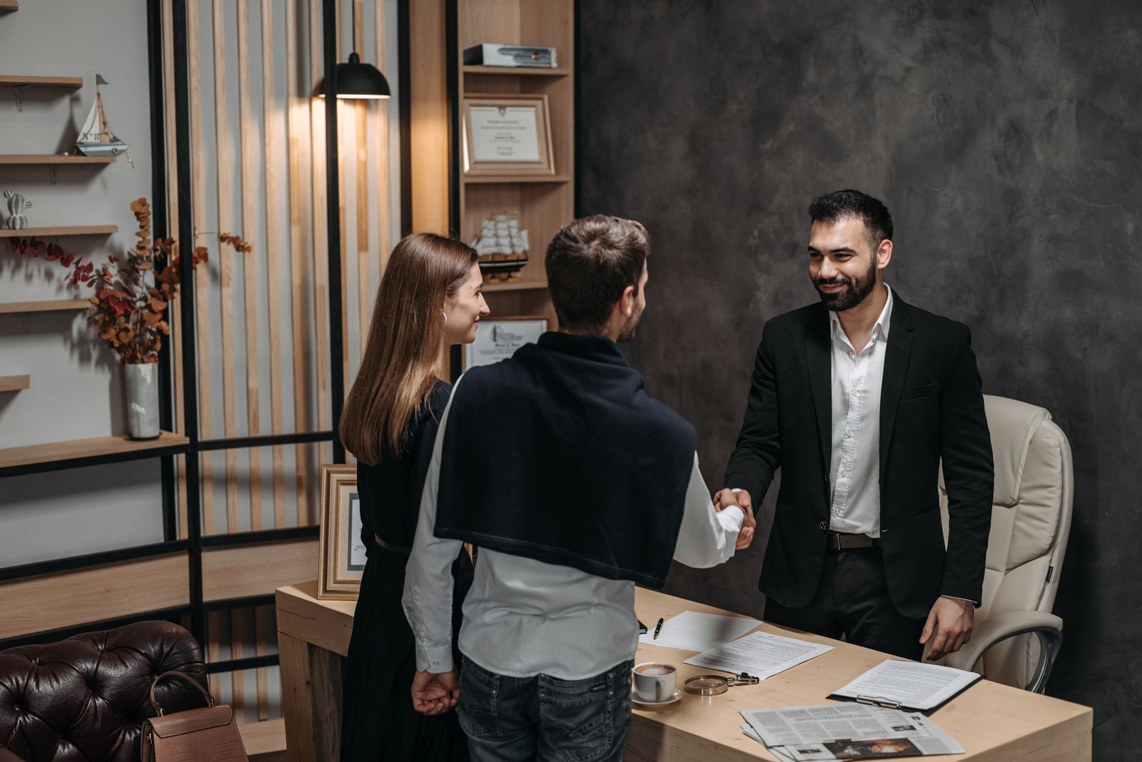 Business partners completing a professional handshake during a meeting